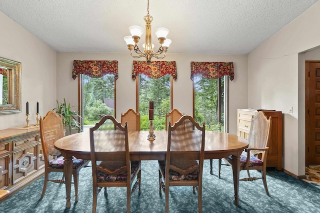 13614 N Minihdoka Trl, Spokane, WA 99208 - carpeted dining room featuring a textured ceiling and a chandelier