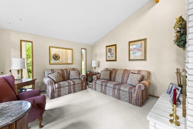 13614 N Minihdoka Trl, Spokane, WA 99208 - living area featuring carpet floors and vaulted ceiling