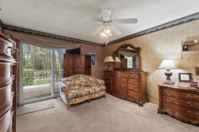 13614 N Minihdoka Trl, Spokane, WA 99208 - living area featuring a textured ceiling, carpet, ceiling fan, and ornamental molding