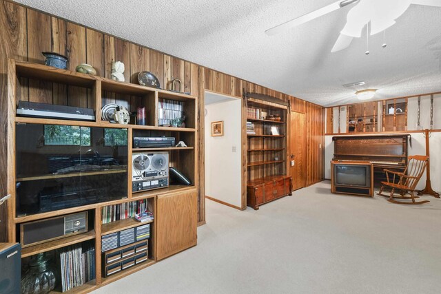 13614 N Minihdoka Trl, Spokane, WA 99208 - office space featuring a textured ceiling, wooden walls, carpet, and a ceiling fan