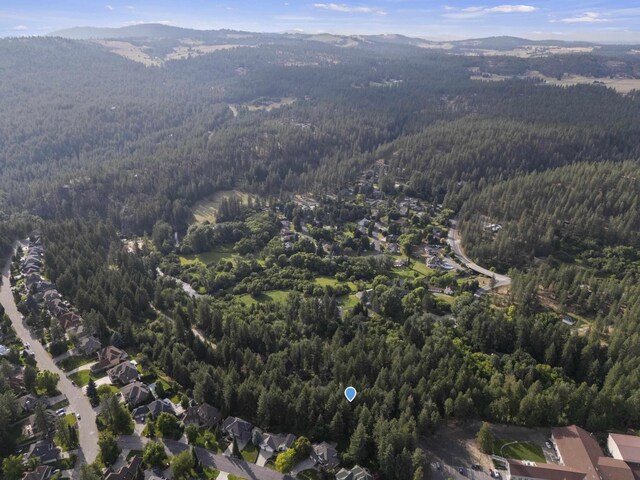 13614 N Minihdoka Trl, Spokane, WA 99208 - wooden terrace featuring view of wooded area