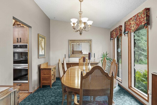 13614 N Minihdoka Trl, Spokane, WA 99208 - dining space featuring a textured ceiling and a chandelier