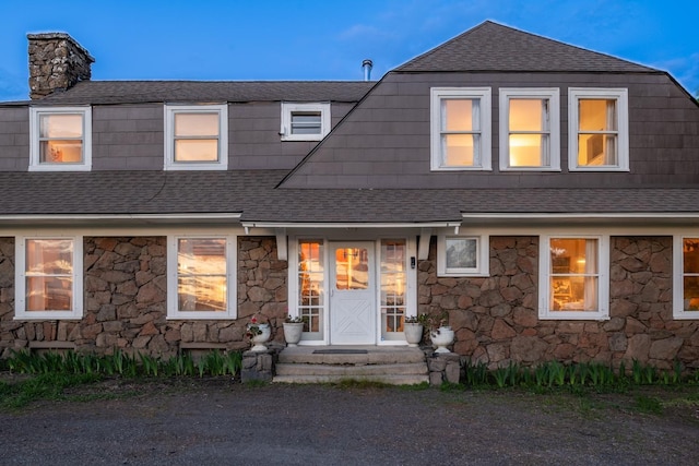 1625 S Hayford Rd, Spokane, WA 99224 - view of front of house featuring stone siding, roof with shingles, and a chimney