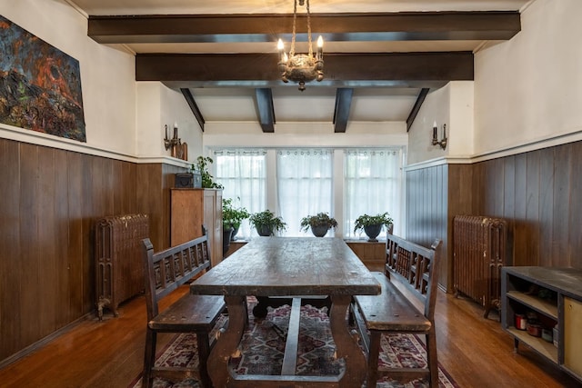 1625 S Hayford Rd, Spokane, WA 99224 - dining room featuring beam ceiling, wood finished floors, radiator, wainscoting, and wood walls