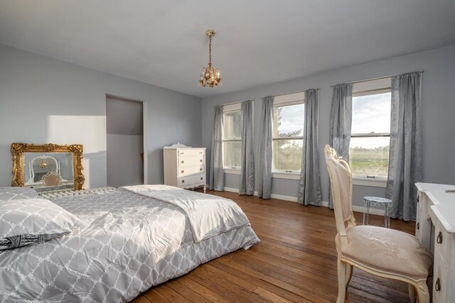 1625 S Hayford Rd, Spokane, WA 99224 - bedroom featuring a chandelier and hardwood / wood-style flooring