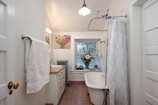 1625 S Hayford Rd, Spokane, WA 99224 - full bathroom with vanity, tile patterned flooring, a freestanding tub, and lofted ceiling