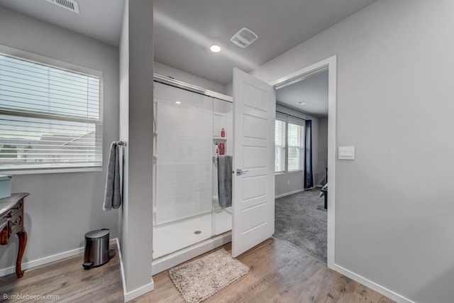 3640 S Clinton Rd, Spokane Valley, WA 99206 - full bath featuring a stall shower, wood finished floors, and vanity