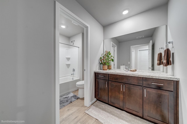 3640 S Clinton Rd, Spokane Valley, WA 99206 - bathroom featuring vanity, wood finished floors, and shower / washtub combination