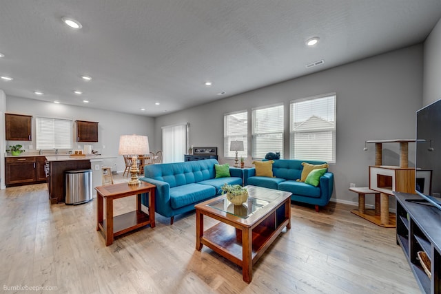 3640 S Clinton Rd, Spokane Valley, WA 99206 - living area featuring plenty of natural light, light wood-style floors, and recessed lighting