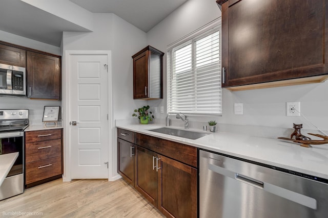 3640 S Clinton Rd, Spokane Valley, WA 99206 - kitchen with stainless steel appliances, light wood-type flooring, and light countertops