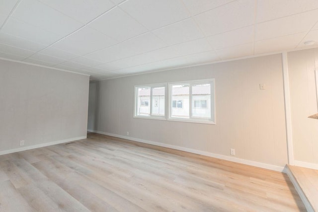 105 E Aspen Ave, Springdale, WA 99173 - spare room with light wood finished floors and a paneled ceiling