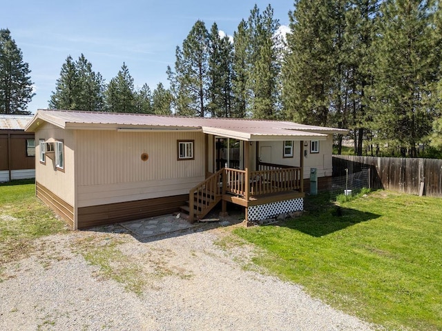 105 E Aspen Ave, Springdale, WA 99173 - manufactured / mobile home featuring a wooden deck and a metal roof