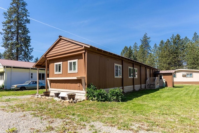 105 E Aspen Ave, Springdale, WA 99173 - view of side of home featuring a yard