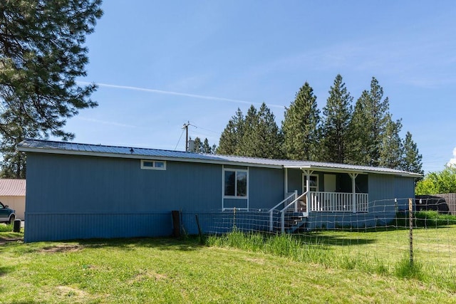 105 E Aspen Ave, Springdale, WA 99173 - view of front of home featuring covered porch and a metal roof