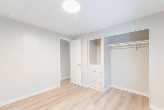 105 E Aspen Ave, Springdale, WA 99173 - unfurnished bedroom featuring wood finished floors and a closet