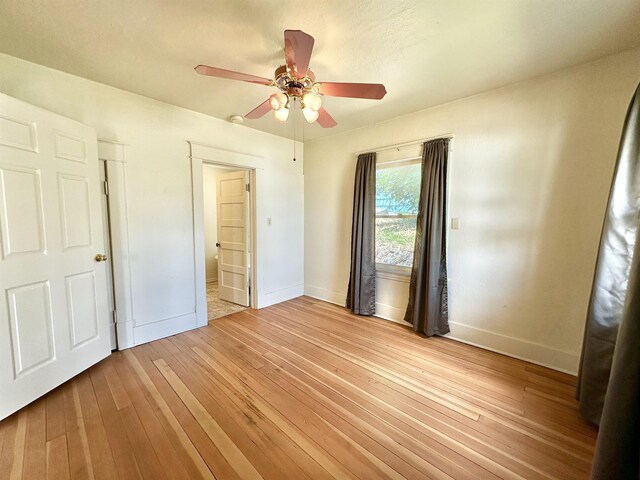 521 N Ramsey St, Tekoa, WA 99033 - unfurnished bedroom with hardwood / wood-style floors and a ceiling fan