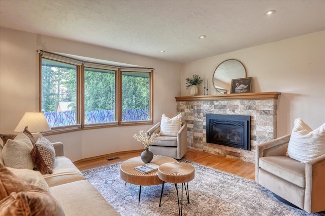 3308 W Kiernan Ave, Spokane, WA 99205 - living area with a tiled fireplace, wood finished floors, and recessed lighting