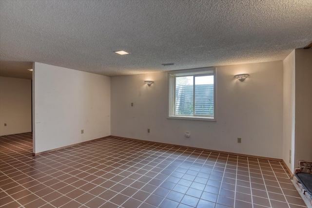 3308 W Kiernan Ave, Spokane, WA 99205 - tiled spare room with a textured ceiling