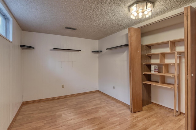 3308 W Kiernan Ave, Spokane, WA 99205 - unfurnished bedroom with light wood-style flooring and a textured ceiling