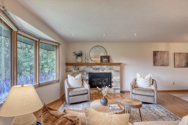 3308 W Kiernan Ave, Spokane, WA 99205 - living room featuring a stone fireplace, wood finished floors, and recessed lighting