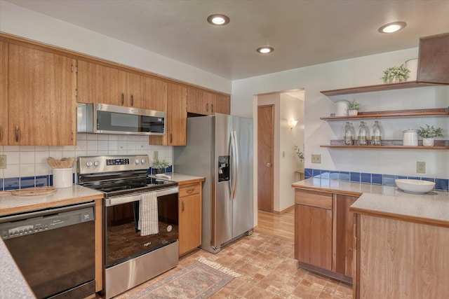 3308 W Kiernan Ave, Spokane, WA 99205 - kitchen with appliances with stainless steel finishes, decorative backsplash, light countertops, open shelves, and recessed lighting