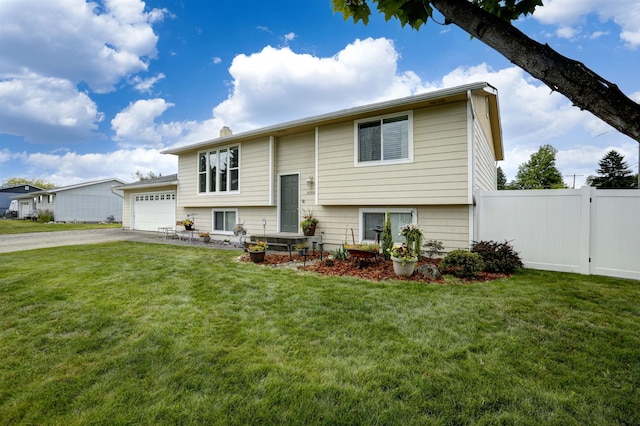 18306 E 3rd Ave, Greenacres, WA 99016 - split foyer home featuring concrete driveway, an attached garage, and a chimney