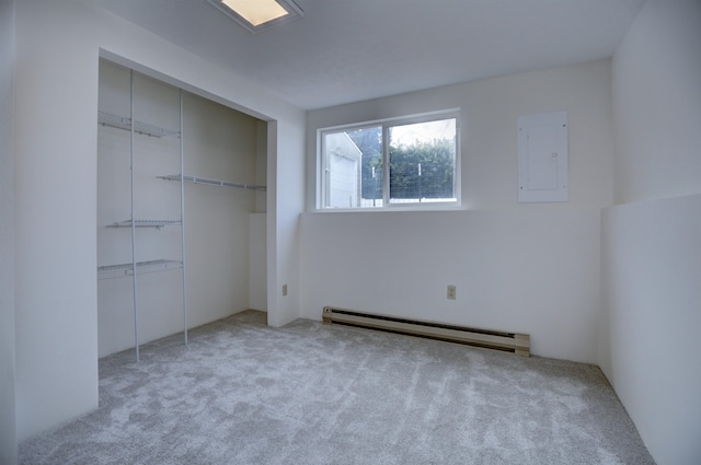 18306 E 3rd Ave, Greenacres, WA 99016 - unfurnished bedroom featuring a baseboard radiator, electric panel, carpet flooring, and a closet