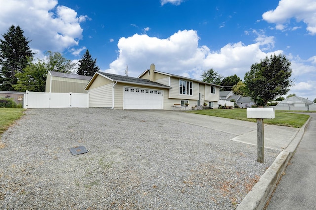 18306 E 3rd Ave, Greenacres, WA 99016 - view of front of property with a gate, an attached garage, and driveway