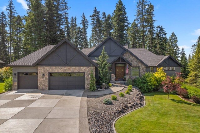 3742 W Cielo View Ct, Coeur D Alene, ID 83814 - craftsman inspired home featuring concrete driveway, stone siding, an attached garage, and a front yard