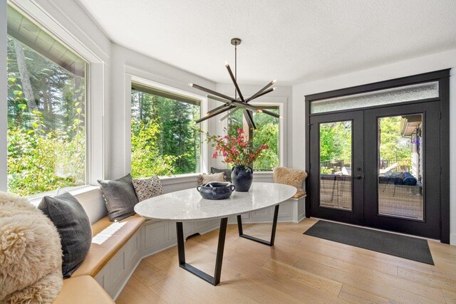 3742 W Cielo View Ct, Coeur D Alene, ID 83814 - dining space featuring french doors, light wood finished floors, and ceiling fan