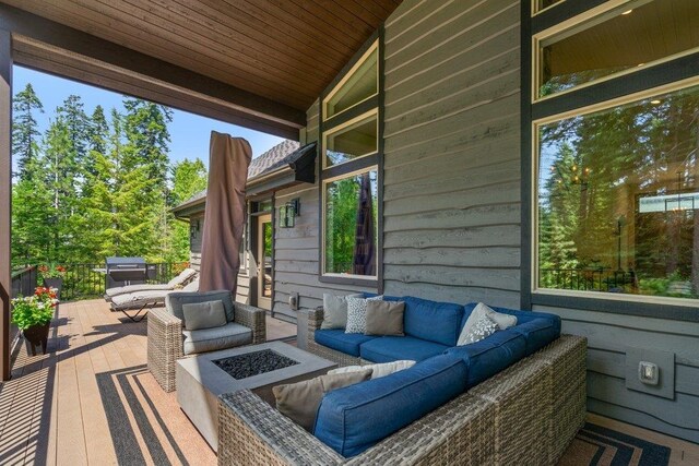 3742 W Cielo View Ct, Coeur D Alene, ID 83814 - wooden terrace with an outdoor living space with a fire pit
