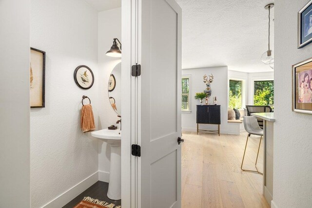 3742 W Cielo View Ct, Coeur D Alene, ID 83814 - hallway with wood finished floors and a textured ceiling