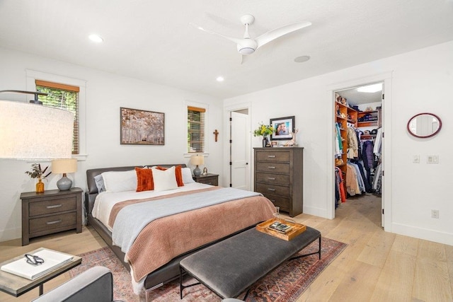 3742 W Cielo View Ct, Coeur D Alene, ID 83814 - bedroom with light wood-style floors, a walk in closet, recessed lighting, ceiling fan, and a closet