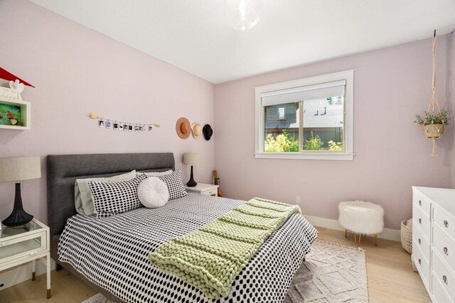 3742 W Cielo View Ct, Coeur D Alene, ID 83814 - bedroom with light wood-style flooring and baseboards