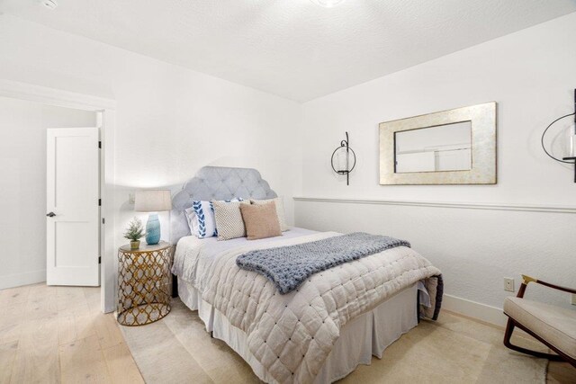 3742 W Cielo View Ct, Coeur D Alene, ID 83814 - bedroom featuring baseboards and wood finished floors