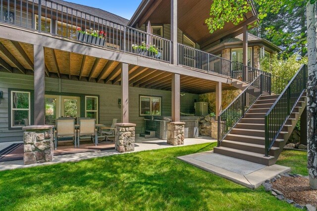 3742 W Cielo View Ct, Coeur D Alene, ID 83814 - back of house with stairs, a lawn, and a patio area