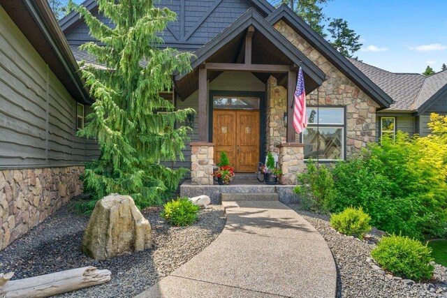 3742 W Cielo View Ct, Coeur D Alene, ID 83814 - doorway to property featuring stone siding