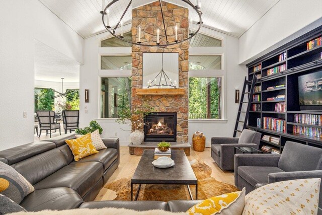 3742 W Cielo View Ct, Coeur D Alene, ID 83814 - living area with a chandelier, a fireplace, high vaulted ceiling, and wood ceiling
