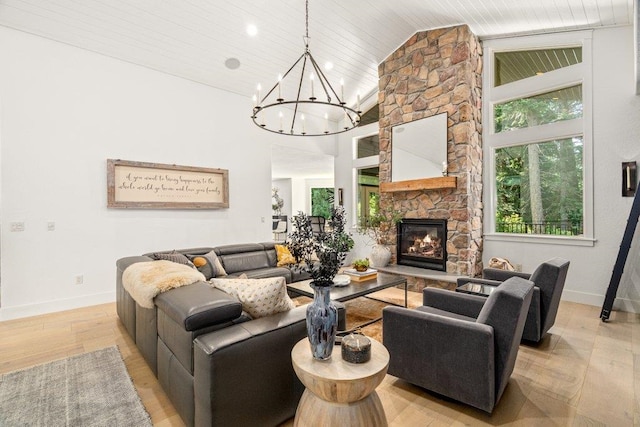3742 W Cielo View Ct, Coeur D Alene, ID 83814 - living room with a chandelier, light wood-type flooring, a fireplace, high vaulted ceiling, and wood ceiling