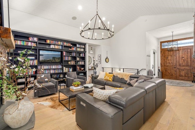 3742 W Cielo View Ct, Coeur D Alene, ID 83814 - living room featuring a chandelier, light wood-style flooring, and lofted ceiling