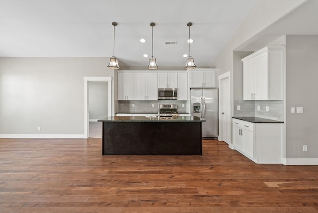 20219 E 11th Ave Unit 20219E 11Th, Greenacres, WA 99016 - kitchen featuring stainless steel appliances, tasteful backsplash, white cabinets, an island with sink, and pendant lighting
