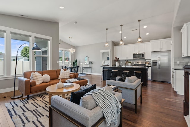 20219 E 11th Ave Unit 20219E 11Th, Greenacres, WA 99016 - living room with vaulted ceiling, dark wood-style flooring, a chandelier, and recessed lighting