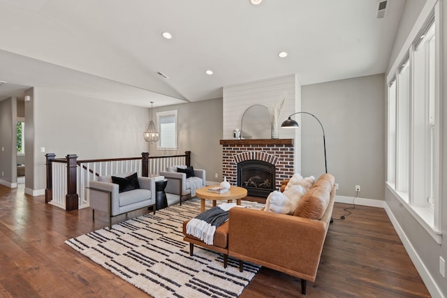 20219 E 11th Ave Unit 20219E 11Th, Greenacres, WA 99016 - living area featuring dark wood-style flooring, vaulted ceiling, a brick fireplace, recessed lighting, and a chandelier