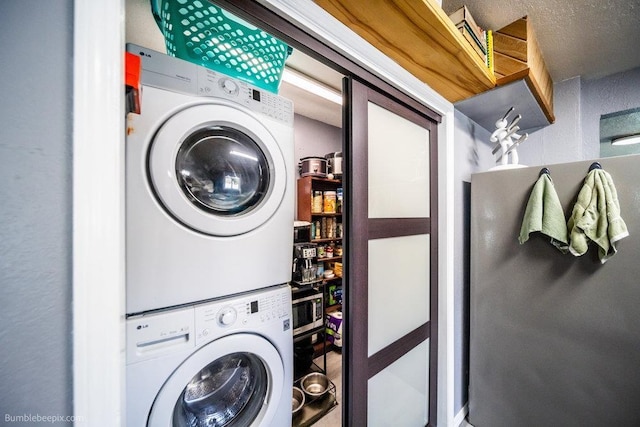 4128 E 22nd Ave, Spokane, WA 99223 - washroom featuring estacked washer and dryer
