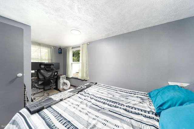 4128 E 22nd Ave, Spokane, WA 99223 - bedroom featuring a textured ceiling, an office area, and a textured wall