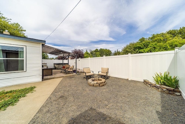 4128 E 22nd Ave, Spokane, WA 99223 - fenced backyard with a fire pit and a patio area