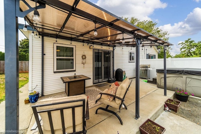 4128 E 22nd Ave, Spokane, WA 99223 - view of patio / terrace featuring a hot tub, a grill, and an outdoor living space