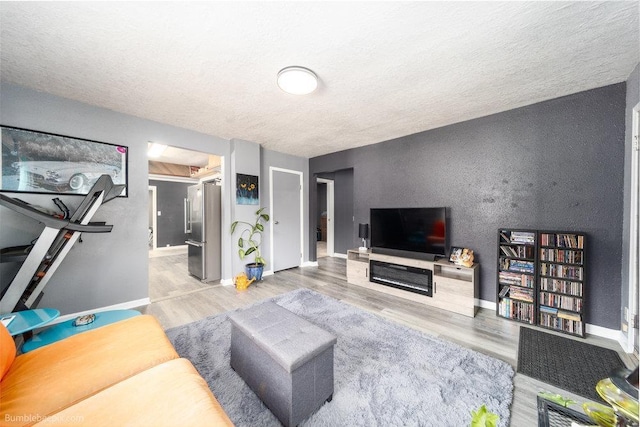4128 E 22nd Ave, Spokane, WA 99223 - living area with wood finished floors and a textured ceiling
