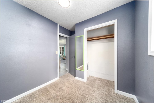 4128 E 22nd Ave, Spokane, WA 99223 - unfurnished bedroom with carpet floors, a closet, and a textured ceiling