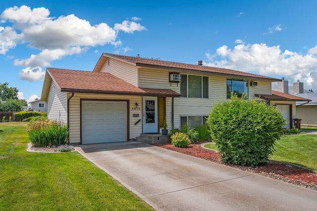 6821 N Hamilton St Unit 1, Spokane, WA 99208 - view of front of property featuring a garage, a front lawn, and driveway